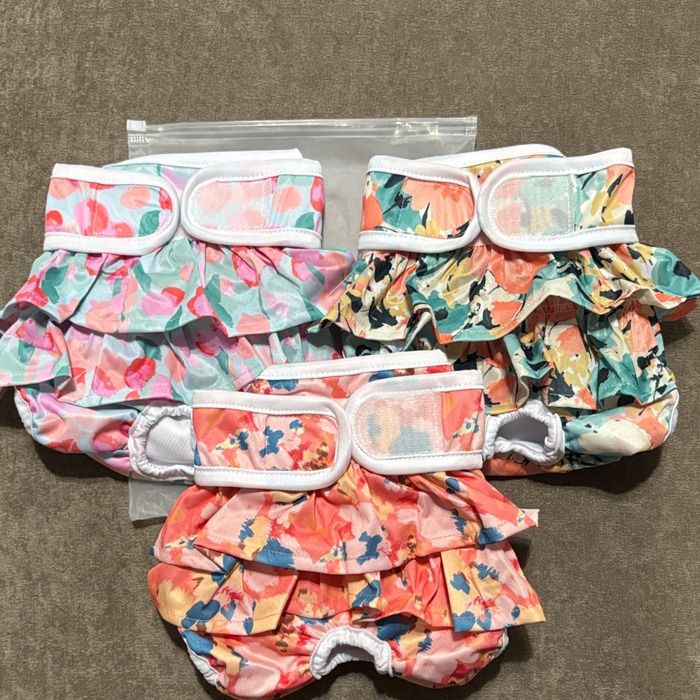 Female dog wraps/diapers with ruffles, size Medium, NWOT.